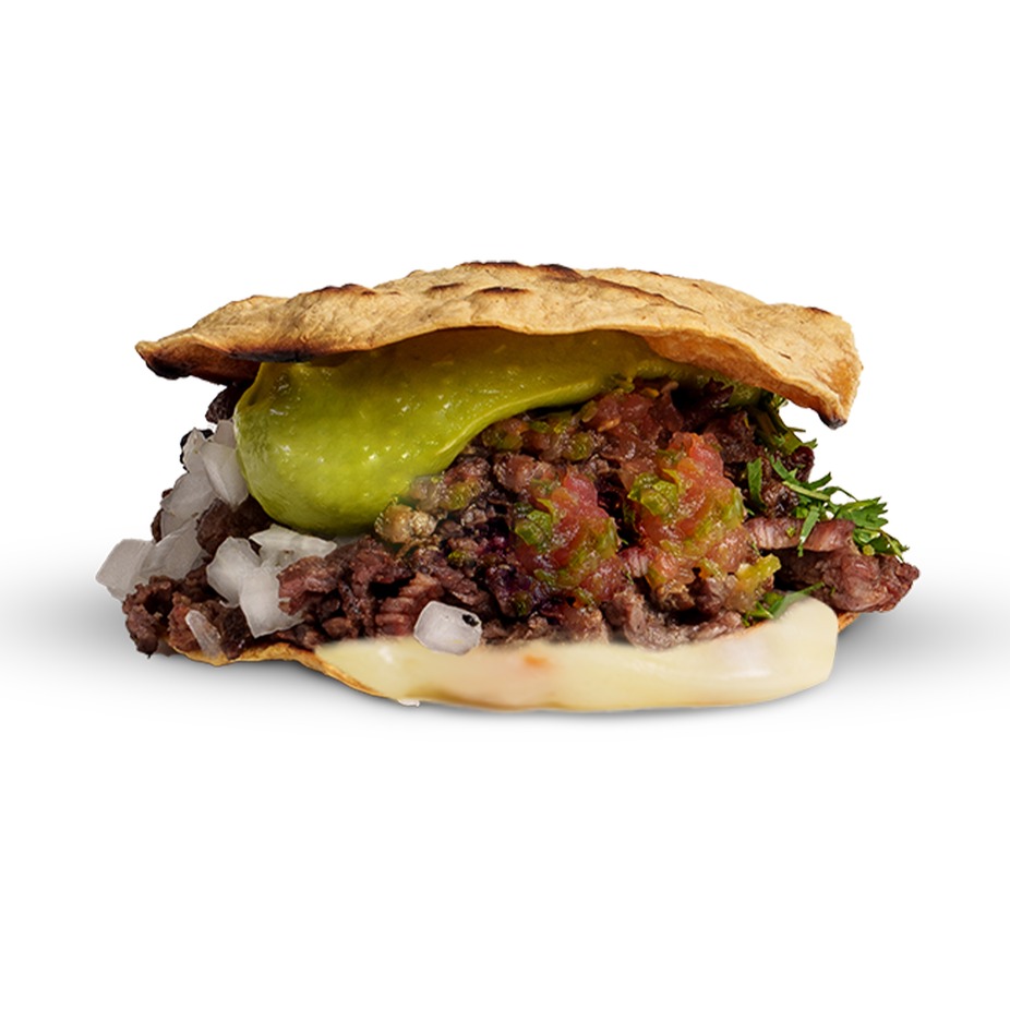 Asada mulita stacked with cheese and guacamole